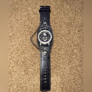 Mei Te watch. The skull opens to show the watch.